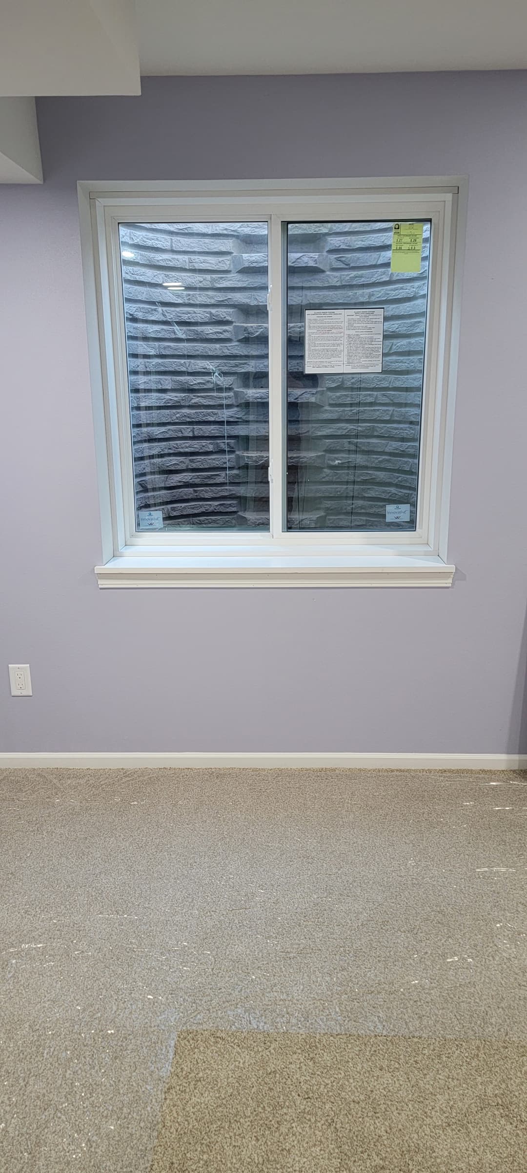 Basement egress window installation with new trim and window well